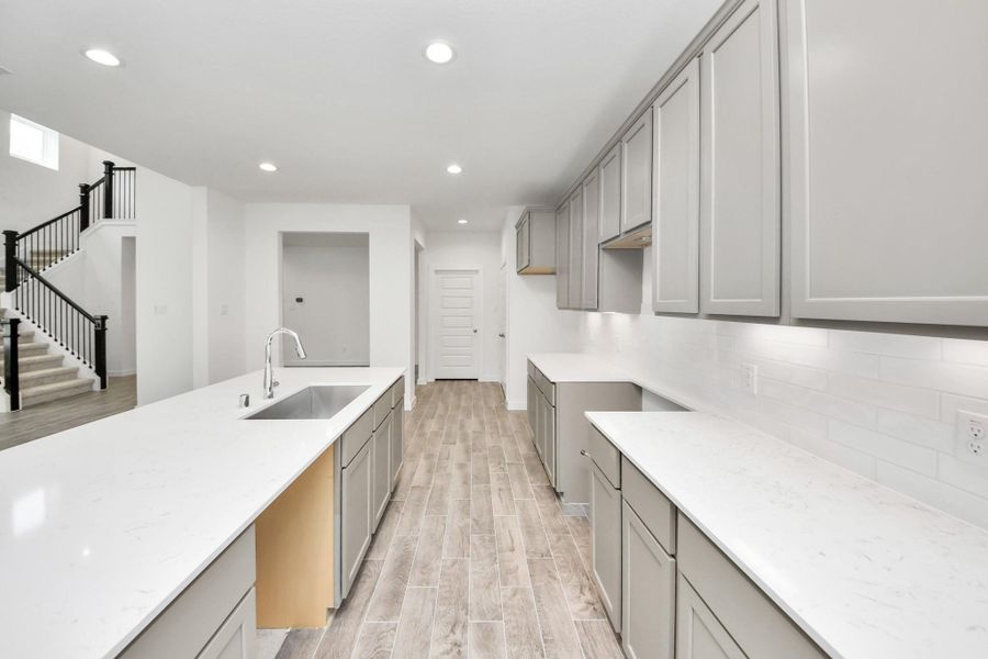 This generously spacious kitchen is a dream realized! Sample photo of completed home with similar floor plan. Actual colors and selections may vary. This generously spacious kitchen is a dream realized! Sample photo of completed home with similar floor plan. Actual colors and selections may vary.