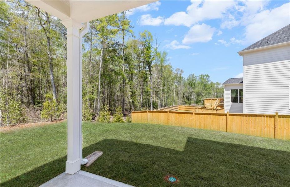 Exterior details and patio area of a home in Reunion, Flowery Branch (Image 28).
