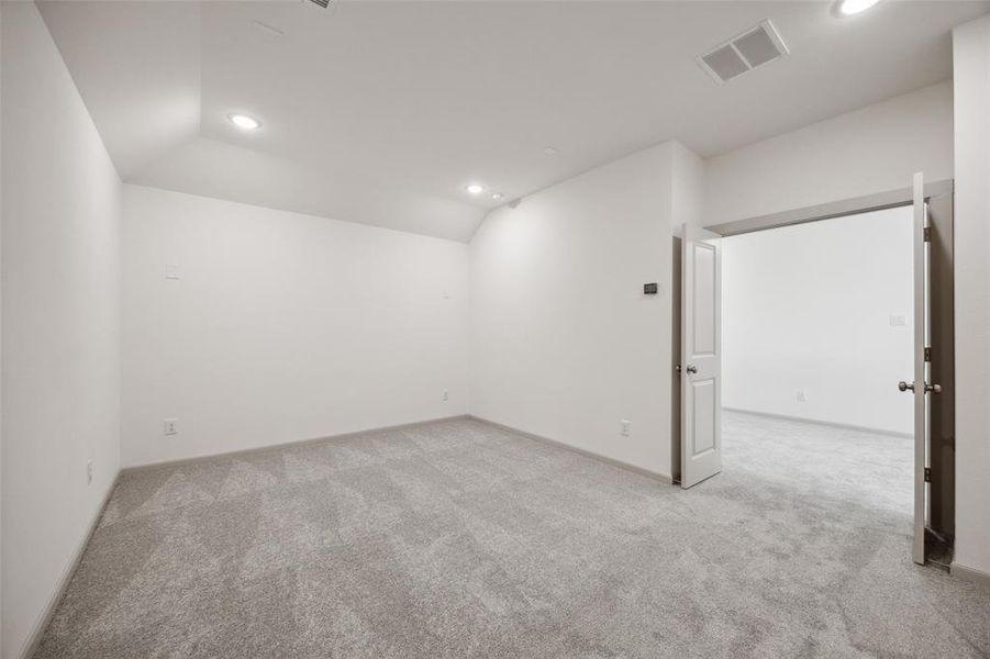 This spacious media room, paired with adjacent game room, provides the ultimate entertaining space in your new home!