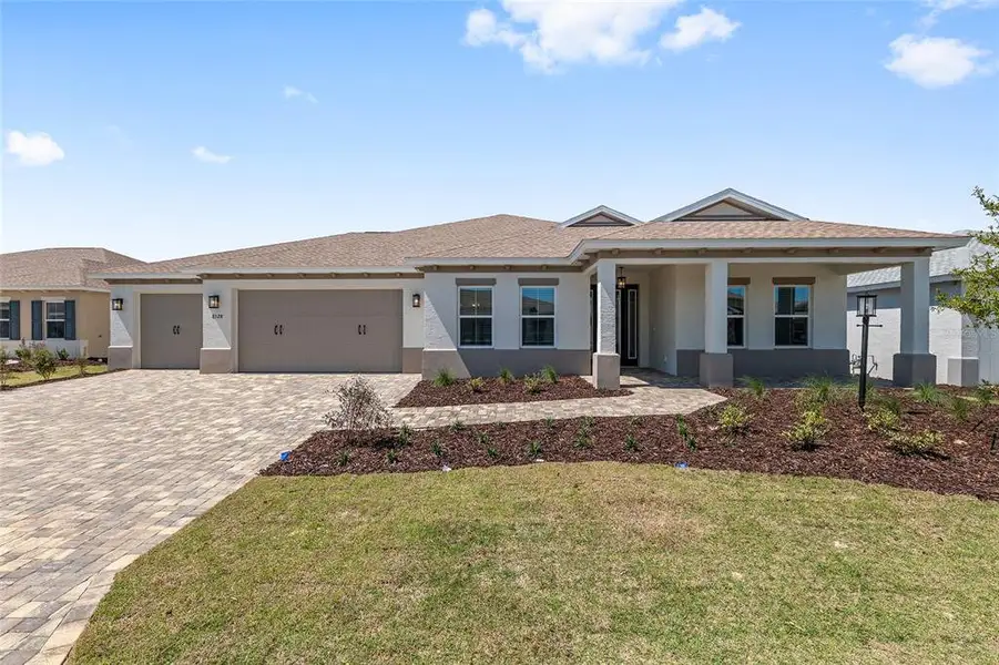 Front exterior of a new home in , Ocala, FL, highlighting curb appeal (Image 25).