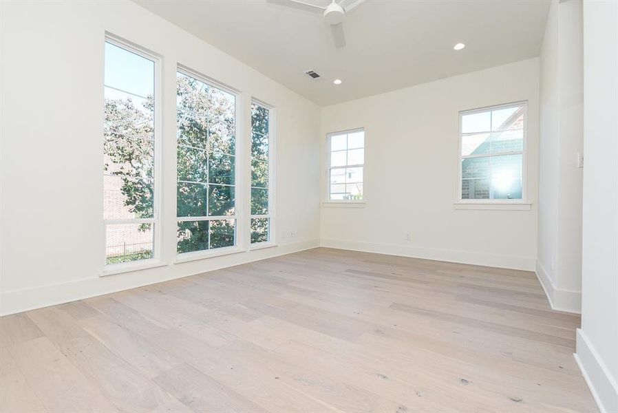 Second floor bedroom #2 or would make a wonderful office with floor to ceiling windows.