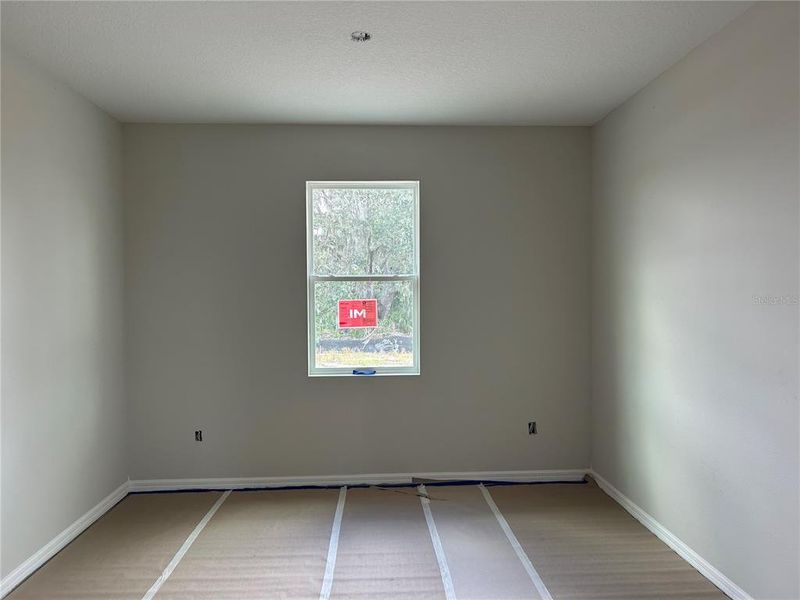 In-progress construction of a new home in Oakfield Trails Signature, Parrish, FL (Image 13).