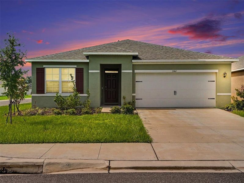 Front exterior of a new home in , Haines City, FL, highlighting curb appeal (Image 22).