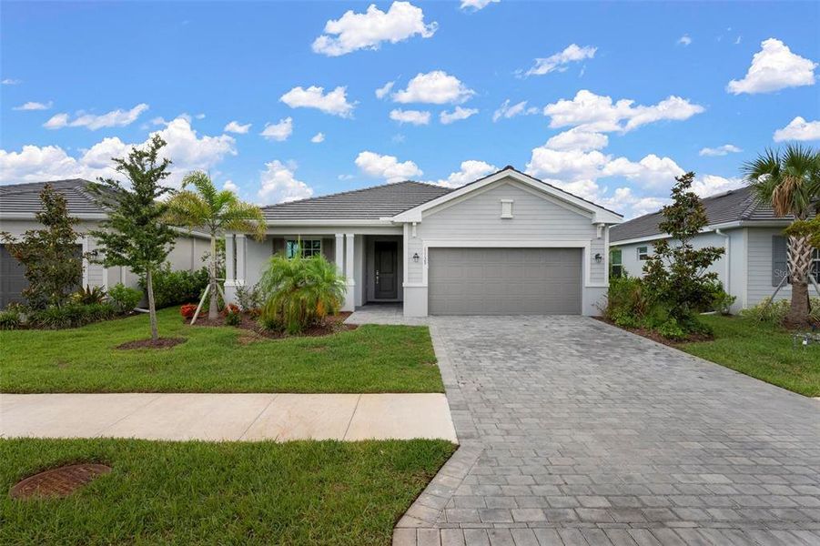 Front exterior of a new home in , Venice, FL, highlighting curb appeal (Image 25).