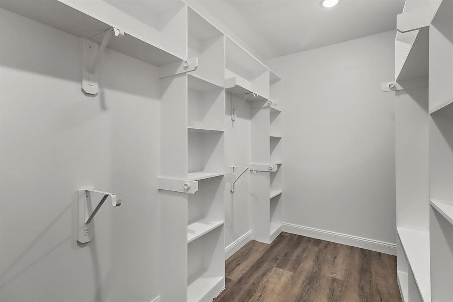 With its custom built-ins and thoughtful design, this master closet is a space that transforms daily routines into moments of indulgence.