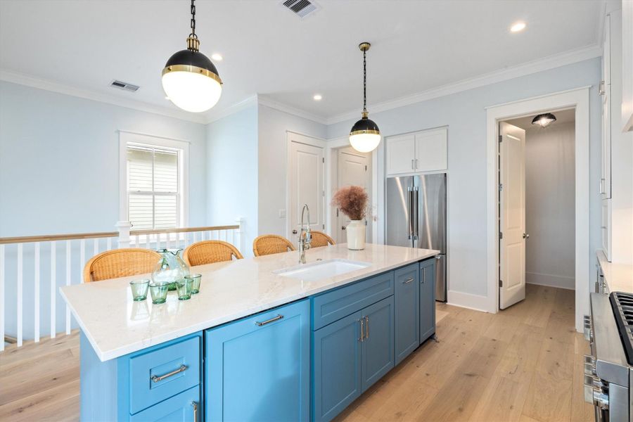 Kitchen also features a separate ice maker in the island