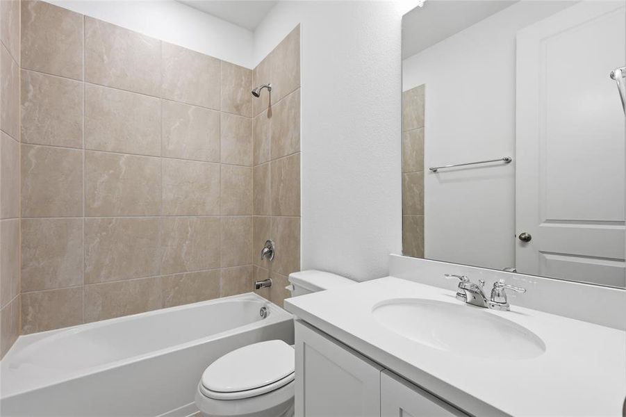 Bathroom with vanity and bathtub / shower combination