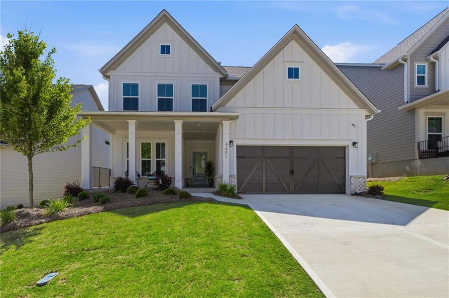 Front exterior of a new home in , Flowery Branch, GA, highlighting curb appeal (Image 21).