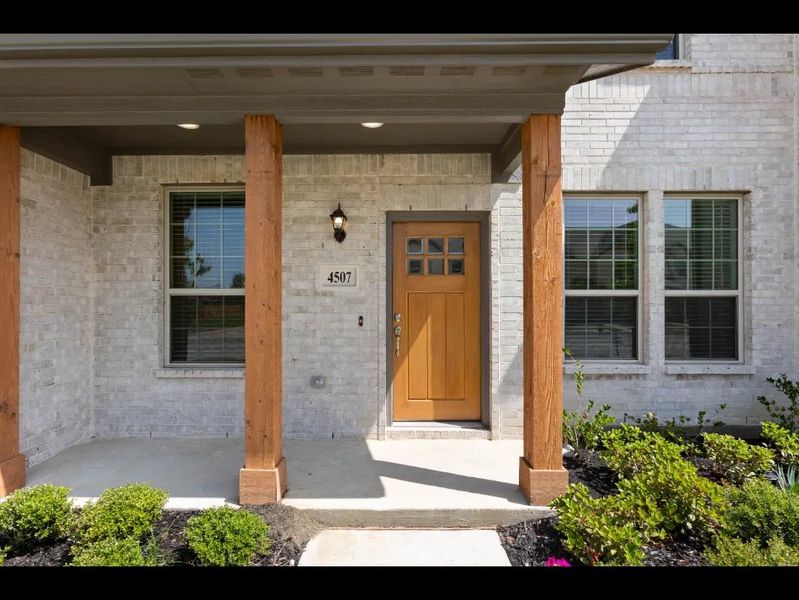 Front exterior of a new home in Sanger Circle, Sanger, TX, highlighting curb appeal (Image 5).