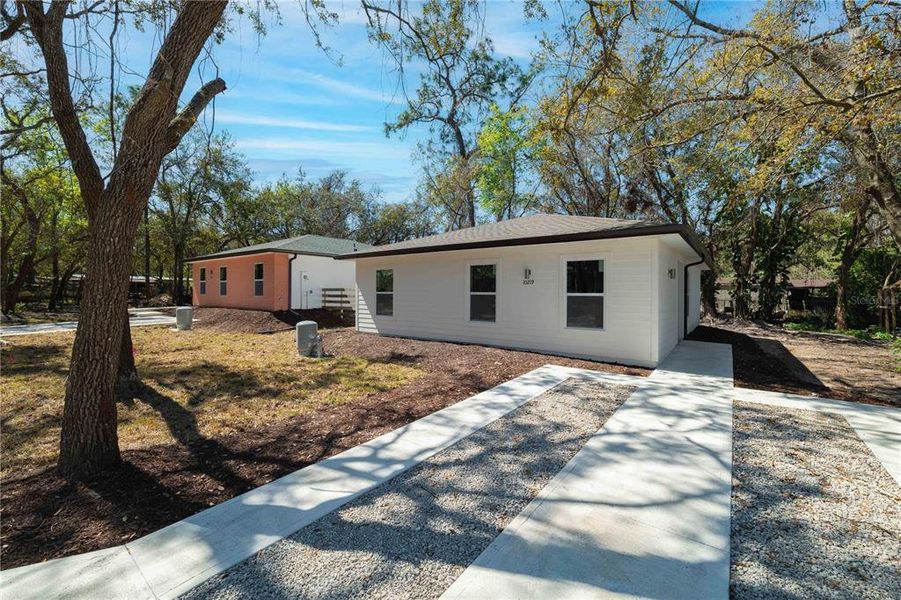 Front exterior of a new home in , New Port Richey, FL, highlighting curb appeal (Image 18).