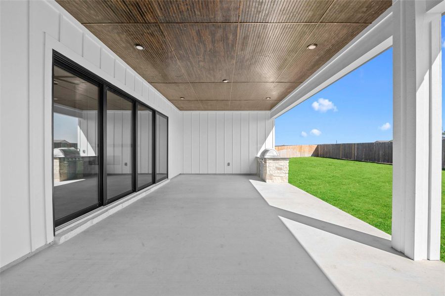 Fenced backyard situated on a half-acre lot, featuring an oversized patio with outdoor kitchen, full irrigation system and landscaping Fenced backyard situated on a half-acre lot, featuring an oversized patio with outdoor kitchen, full irrigation system and landscaping