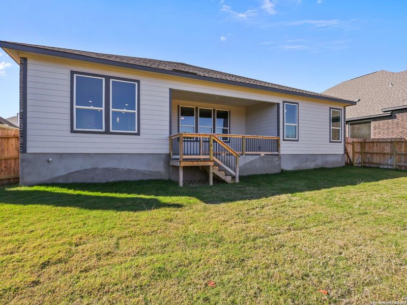 Exterior details and patio area of a home in The Reserve at Potranco Oaks, Castroville (Image 4).