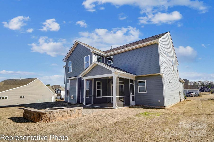 Homesite 36 features a covered porch and the paver patio with firepit