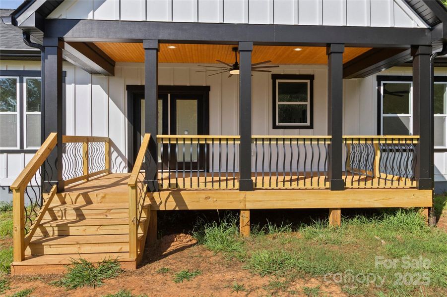 Rear deck with 72" ceiling fan and wooden ceilings. This is an uograded over size deck.
