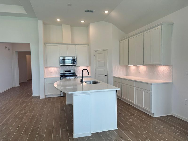 Furnished interior view inside a new home in Creekhaven, Iowa Colony (Image 7).