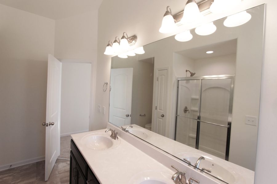 Furnished interior in a model home at The Wilcox in Greensboro (Image 18).