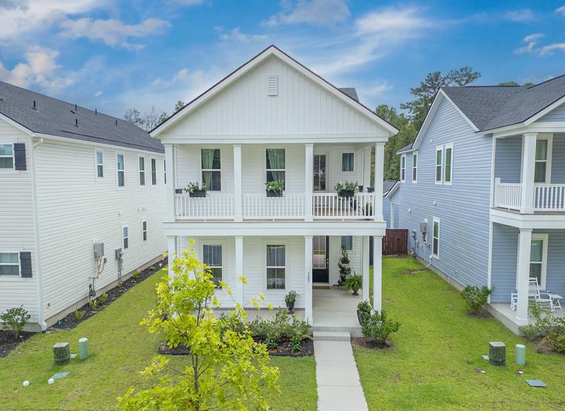 Front exterior of a new home in Limehouse Village: Row Collection, Summerville, SC, highlighting curb appeal (Image 27).