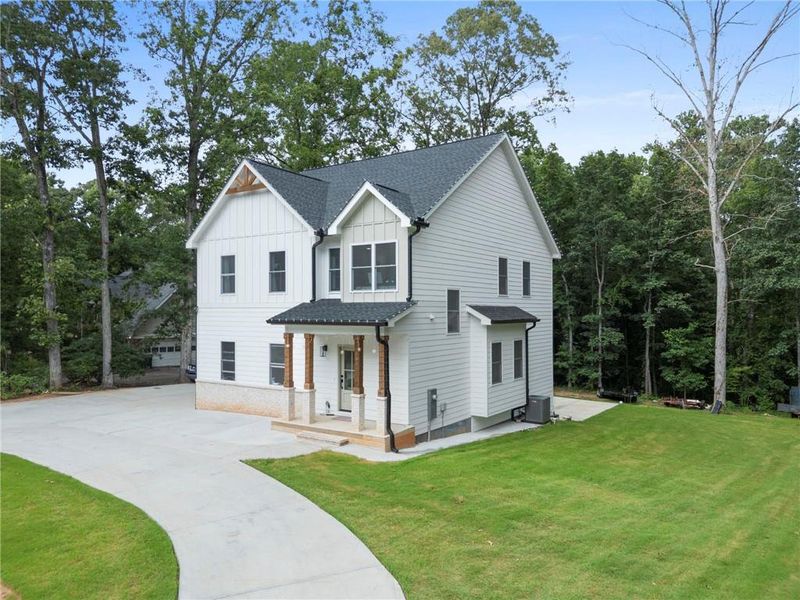 Front exterior of a new home in , Snellville, GA, highlighting curb appeal (Image 2).