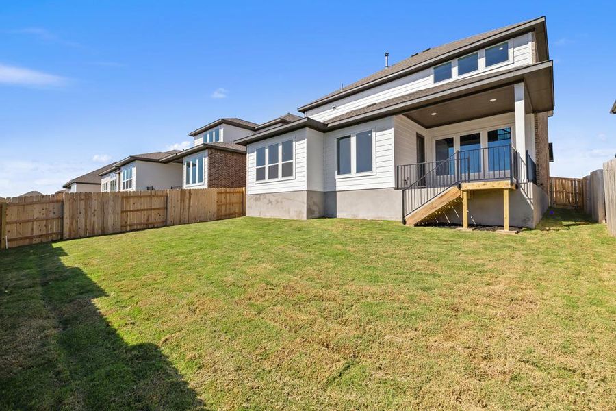 Exterior details and patio area of a home in Lariat, Liberty Hill (Image 26).