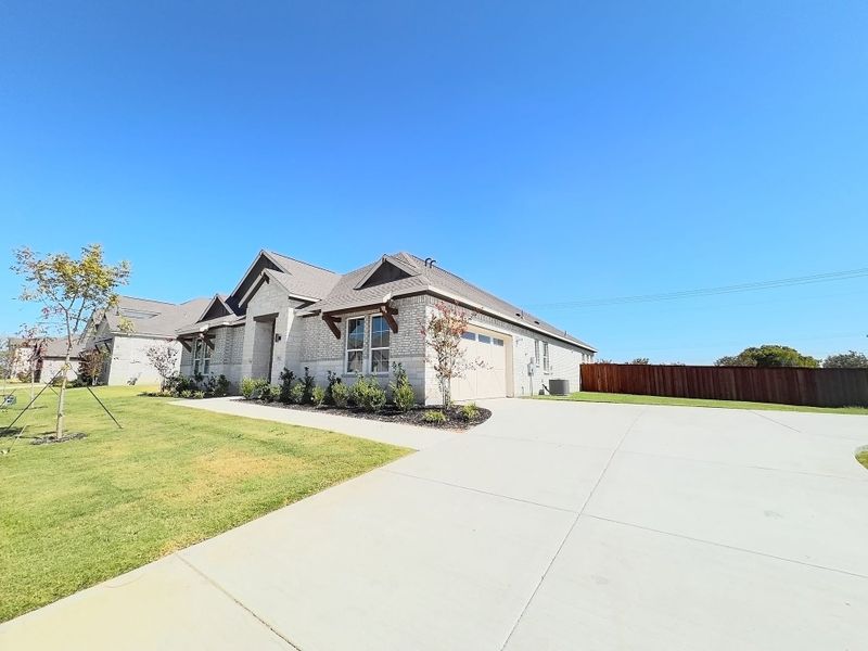 Front exterior of a new home in Polo Ridge, Mesquite, TX, highlighting curb appeal (Image 19).