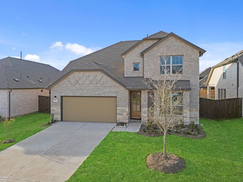 Front exterior of a new home in Brookewater, Rosenberg, TX, highlighting curb appeal (Image 23).