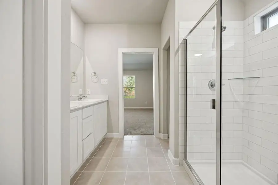 Primary Bathroom in the Oscar home plan by Trophy Signature Homes – REPRESENTATIVE PHOTO