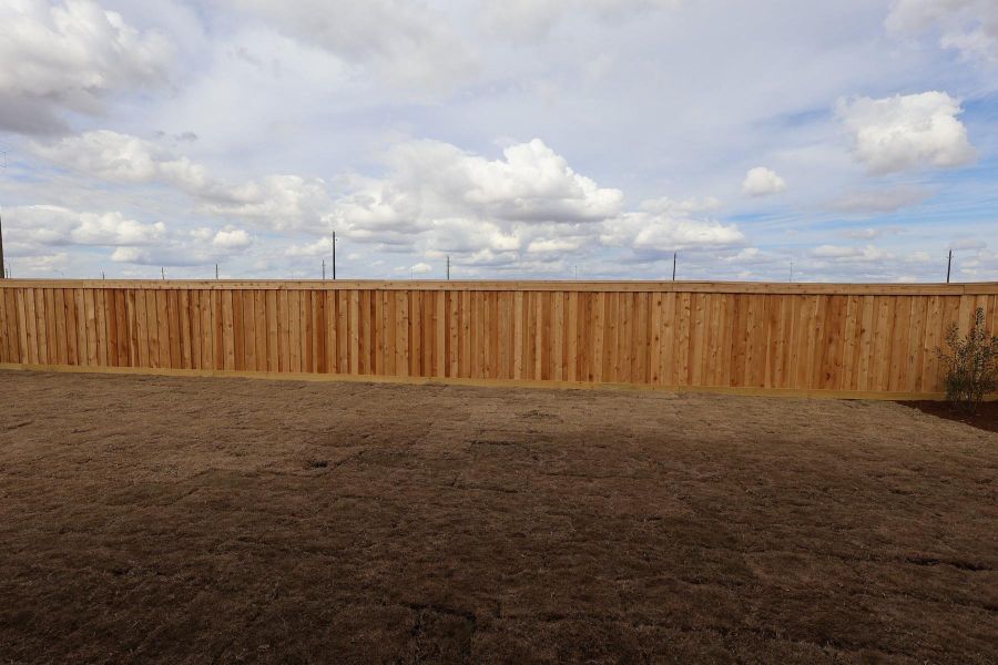 Exterior details and patio area of a home in Dunham Pointe, Cypress (Image 22).