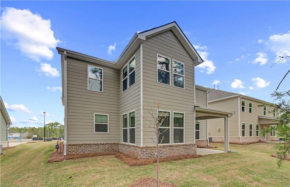 Front exterior of a new home in Cooper Park, McDonough, GA, highlighting curb appeal (Image 14).