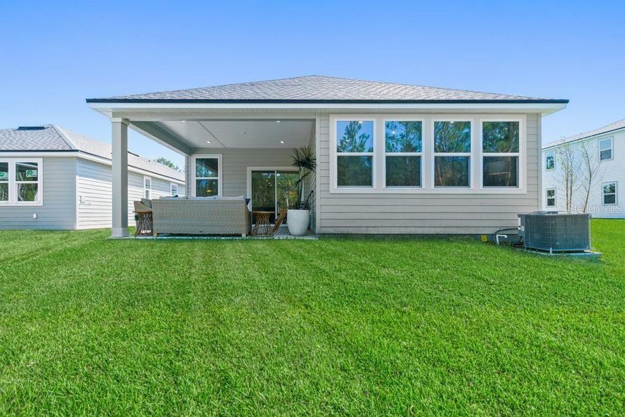 Exterior details and patio area of a home in Seminole Palms, Palm Coast (Image 33).