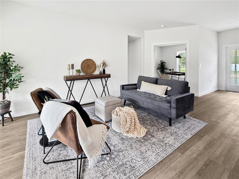 Similar Model Living Area with Den/Office in Background