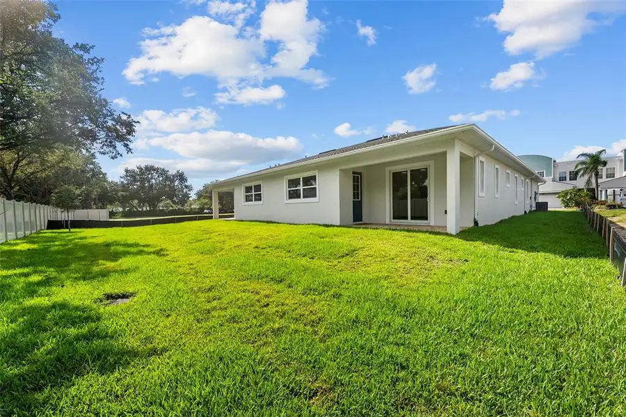 Exterior details and patio area of a home in , Tarpon Springs (Image 32).