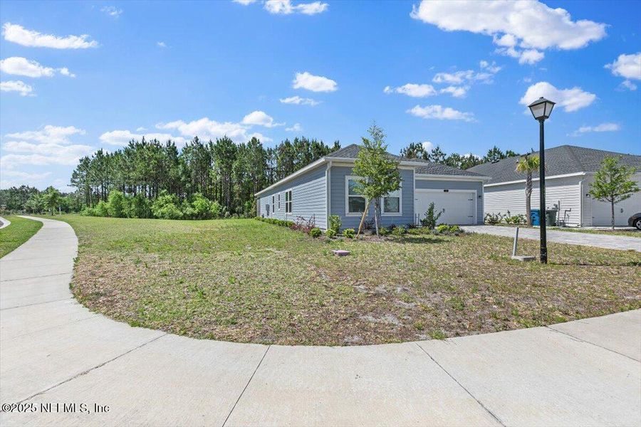 Front exterior of a new home in , St. Augustine, FL, highlighting curb appeal (Image 18).