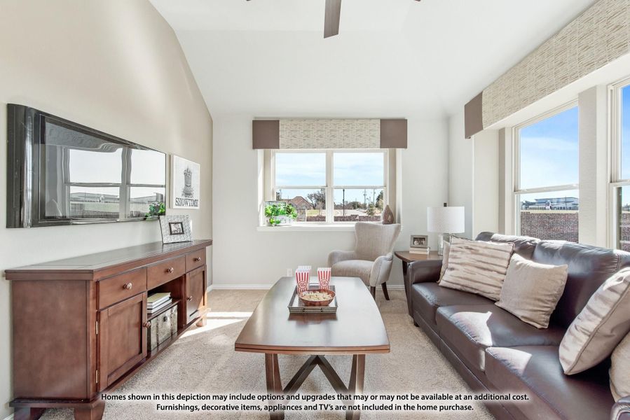 Living room with vaulted ceiling, leather sofa, wall-mounted TV, and large windows with natural light Living room with vaulted ceiling, leather sofa, wall-mounted TV, and large windows with natural light