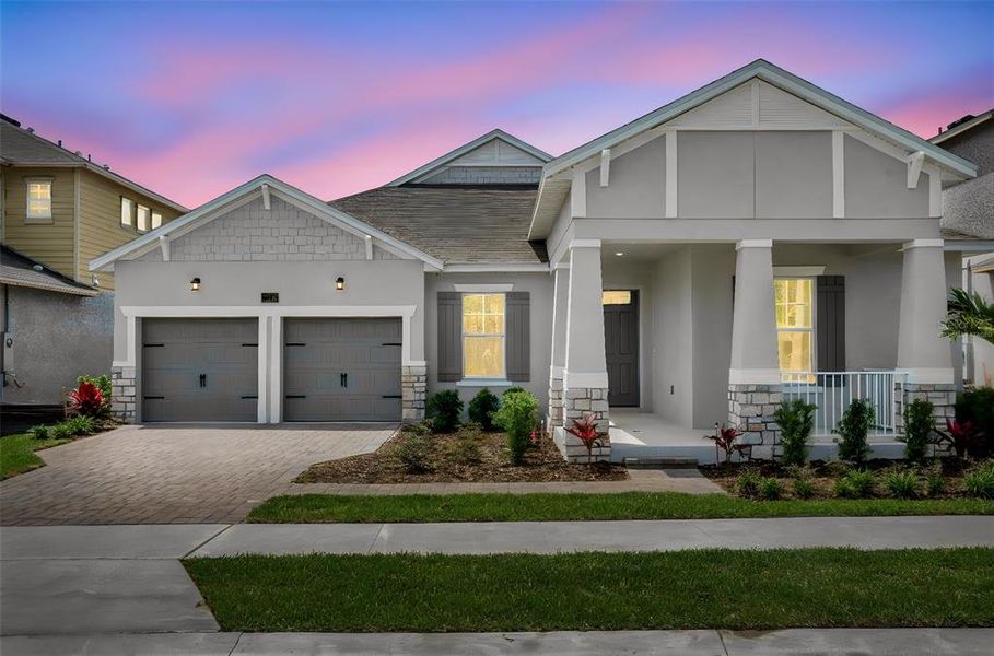 Front exterior of a new home in Avalon Woods, Winter Garden, FL, highlighting curb appeal (Image 22). Front exterior of a new home in Avalon Woods, Winter Garden, FL, highlighting curb appeal (Image 22).