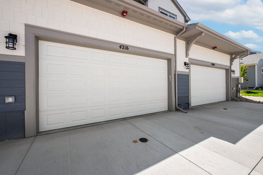 Exterior details and patio area of a home in The Lakes at Centerra, Loveland (Image 14).