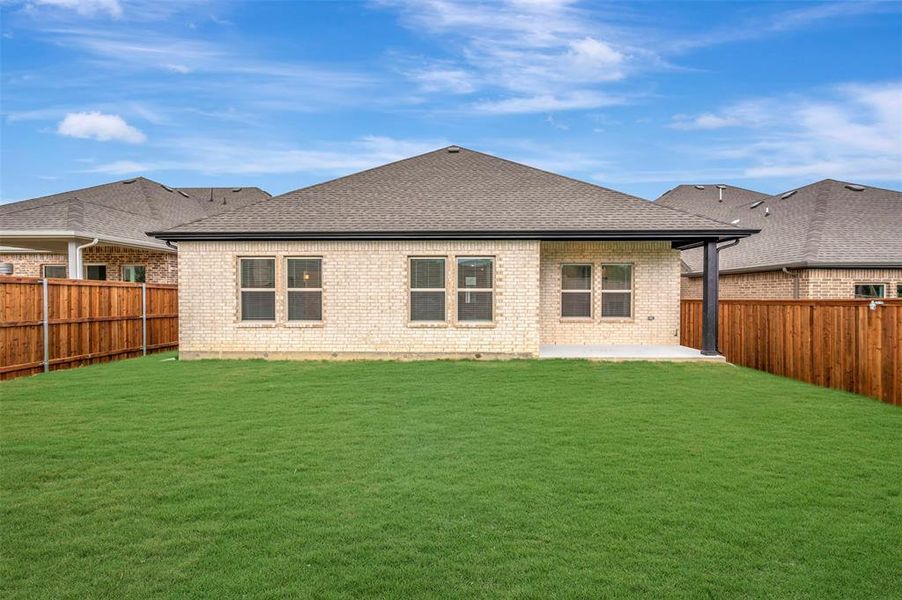 Exterior details and patio area of a home in Aspire at Reunion, Newark (Image 18).