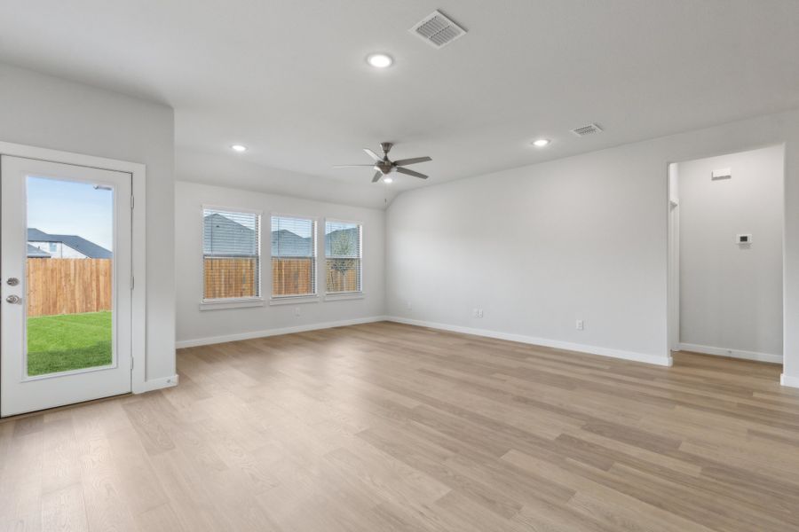 Living Room in the Harrison home plan by Trophy Signature Homes – REPRESENTATIVE PHOTO