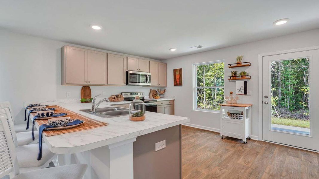 Representative furnished interior of a home built from the LEWIS by D.R. Horton in Longleaf Village, Rincon (Image 12).