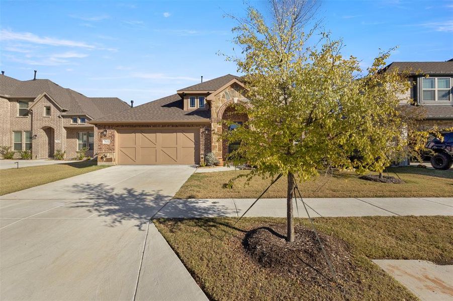 Front exterior of a new home in Union Park Classic 60, Little Elm, TX, highlighting curb appeal (Image 2).