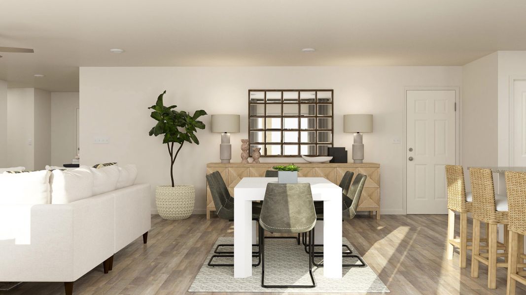 A living room with a table and chairs. A living room with a table and chairs.