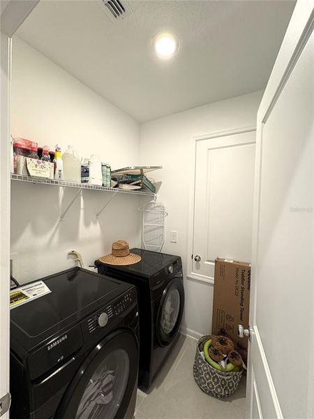 Furnished interior view inside a new home in Peace Creek Reserve: Grand Collection, Winter Haven (Image 6).
