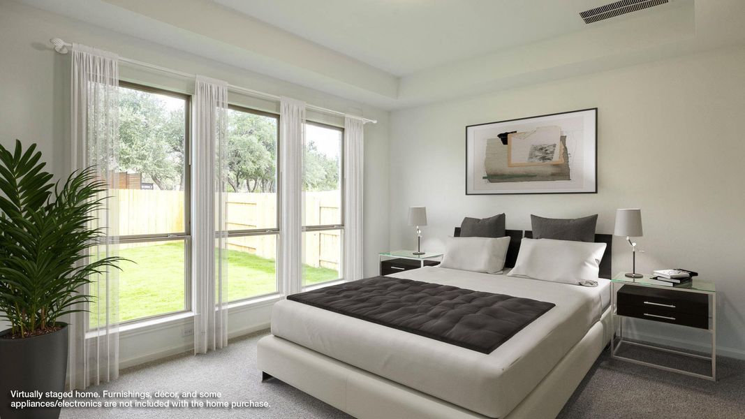 Carpeted bedroom with baseboards Carpeted bedroom with baseboards