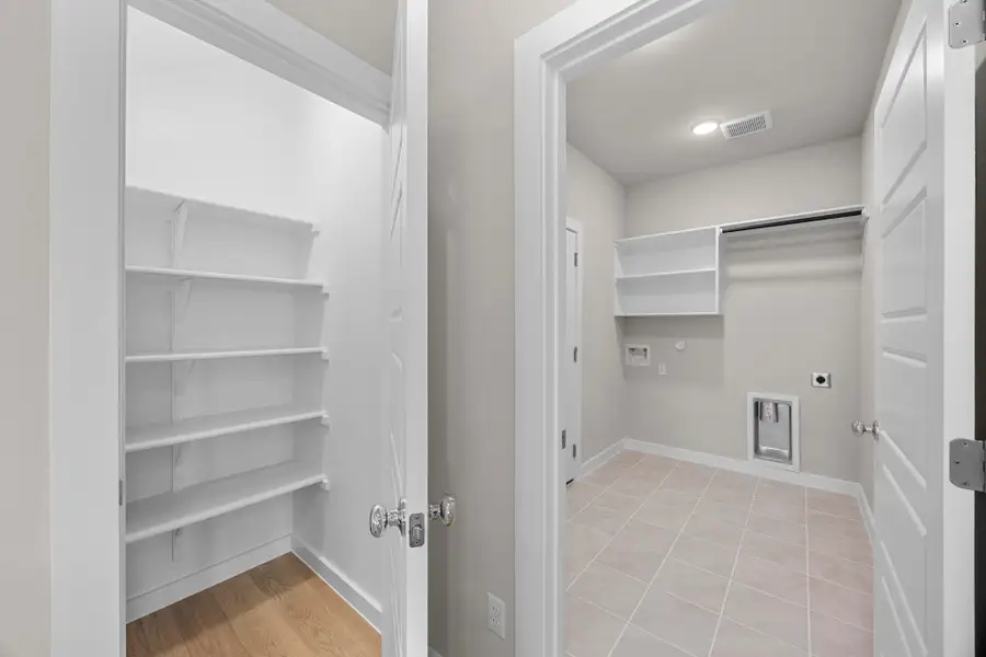 Pantry and Utility Room in the Magnolia home plan by Trophy Signature Homes – REPRESENTATIVE PHOTO Pantry and Utility Room in the Magnolia home plan by Trophy Signature Homes – REPRESENTATIVE PHOTO