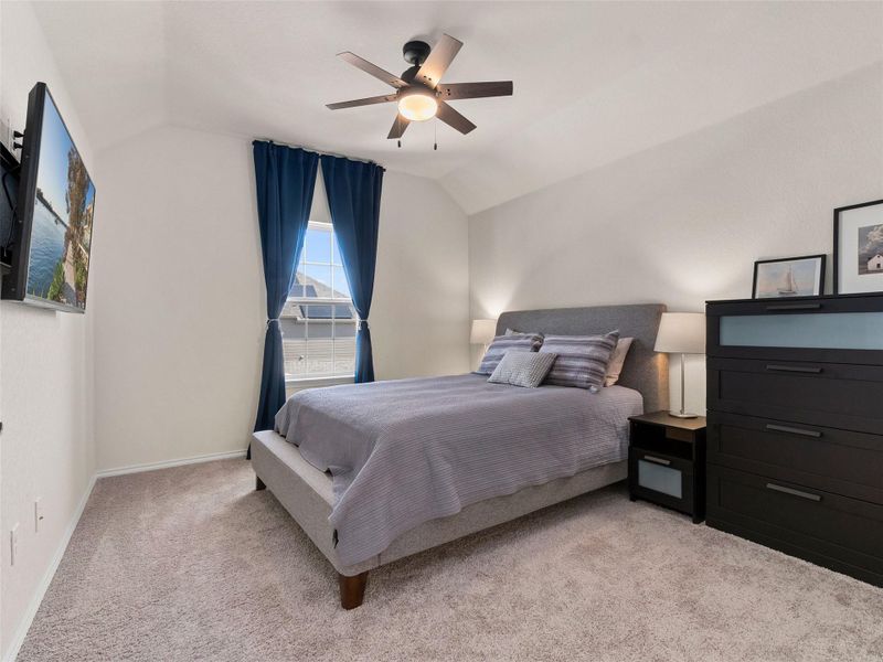 Bedroom with carpet floors, and a ceiling fan
