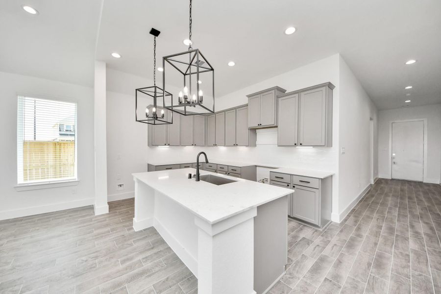 The open concept effortlessly connects the kitchen to the expansive family room, forming a perfect hub for gatherings. This seamless flow creates an inviting space where cooking and socializing come together harmoniously. The open concept effortlessly connects the kitchen to the expansive family room, forming a perfect hub for gatherings. This seamless flow creates an inviting space where cooking and socializing come together harmoniously.