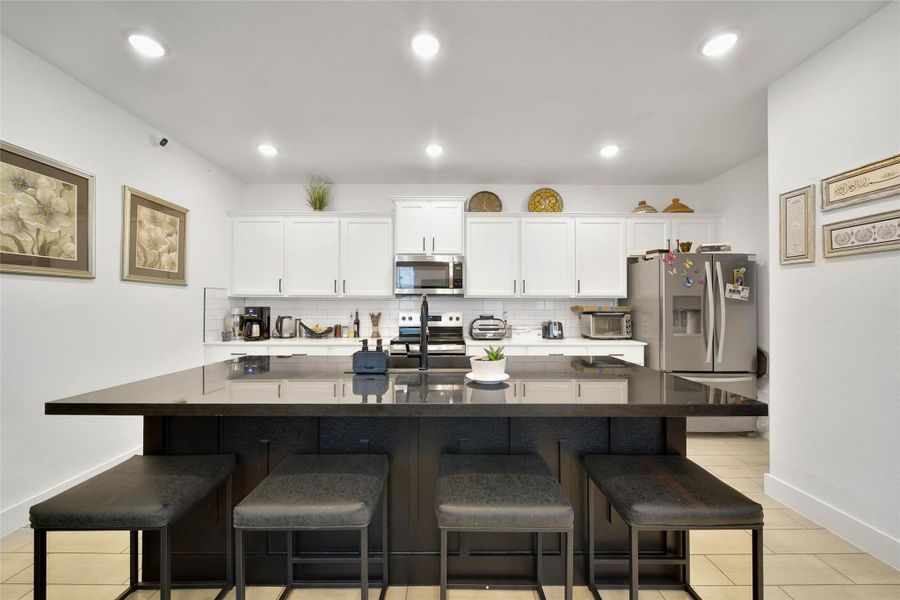 Open kitchen with a large Bar/ Island