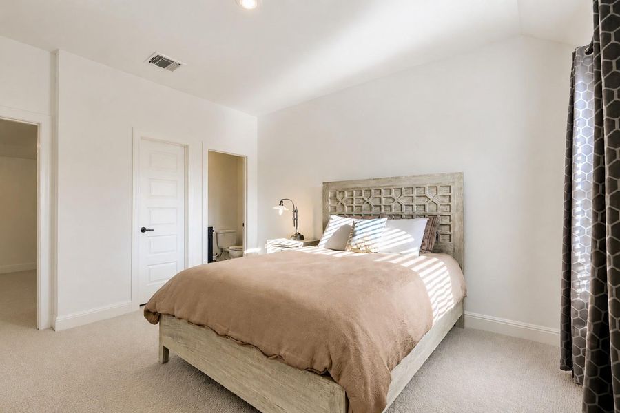 Well-lit sleeping quarters with plush carpeting and an adjoining private bath. Well-lit sleeping quarters with plush carpeting and an adjoining private bath.