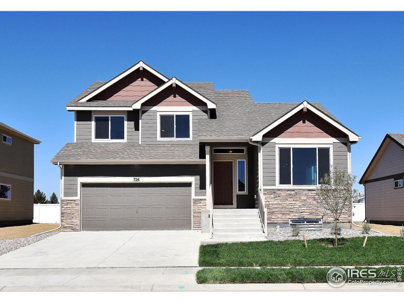 Front exterior of a new home in Southridge, Johnstown, CO, highlighting curb appeal (Image 1).