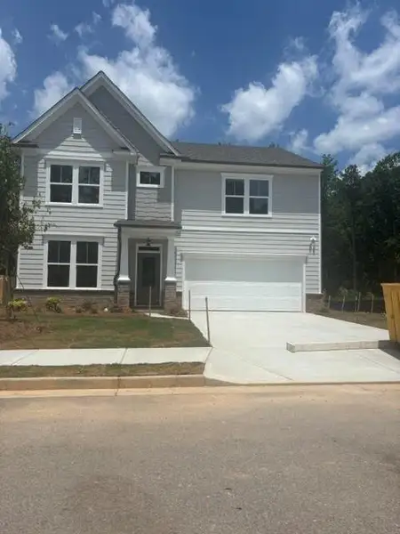 Front exterior of a new home in Edenglen, Buford, GA, highlighting curb appeal (Image 2). Front exterior of a new home in Edenglen, Buford, GA, highlighting curb appeal (Image 2).