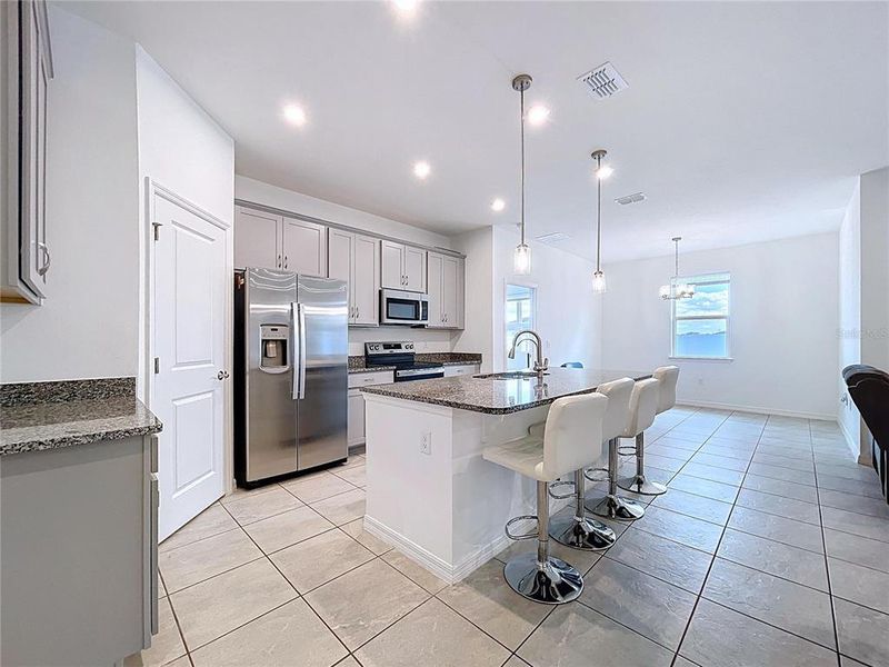 Furnished interior view inside a new home in Covered Bridge at Liberty Bluff, Haines City (Image 9).